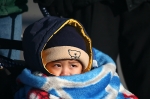 Boy wrapped in blanket - Beijing